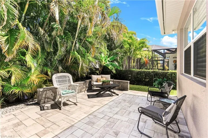 Backyard with paver area for outdoor entertaining.