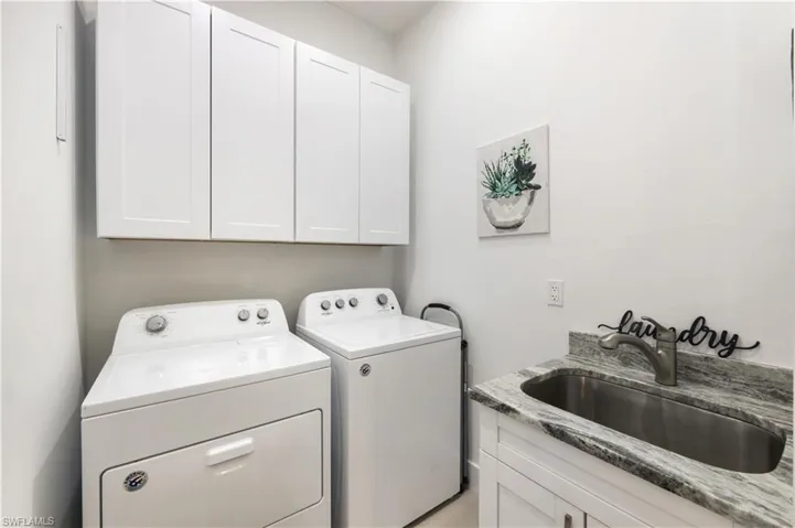 Laundry room with utility sink.