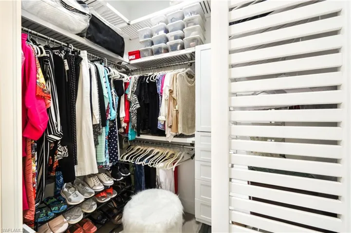 View of walk in custom closets.
