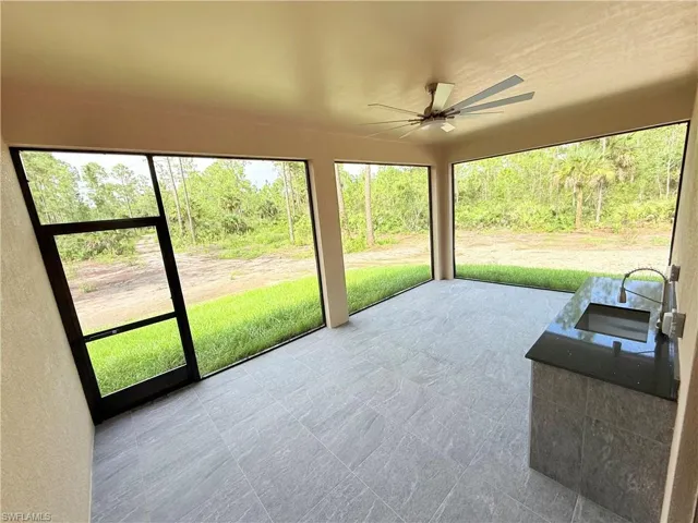Sunroom / solarium with a ceiling fan