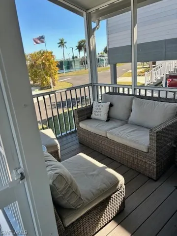Sunroom featuring an outdoor living space