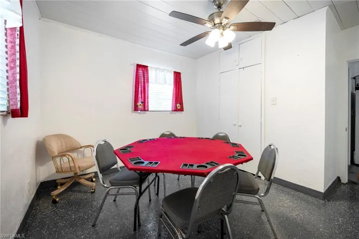 Dining room featuring a ceiling fan and wooden ceiling