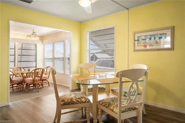 Dining room featuring wood finished floors and baseboards