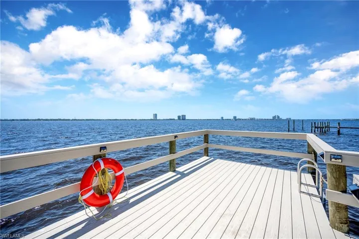 Dock area featuring a water view