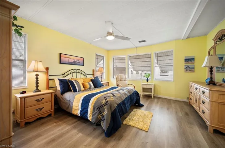 Bedroom with wood finished floors and ceiling fan