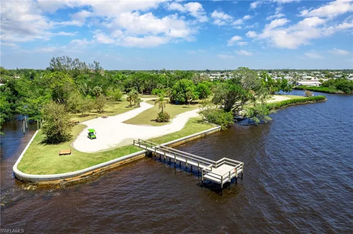 Bird's eye view of a nearby body of water and a tree filled landscape