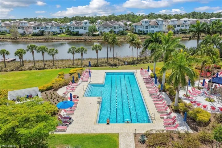 Expansive community pool area featuring a multi-lane lap pool and a separate leisure pool