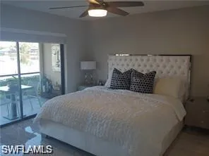Bedroom with a ceiling fan and access to exterior