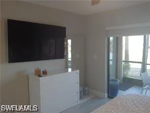 Bedroom with baseboards and a ceiling fan