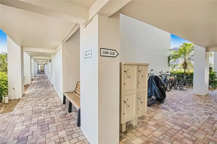 View of patio featuring mail area