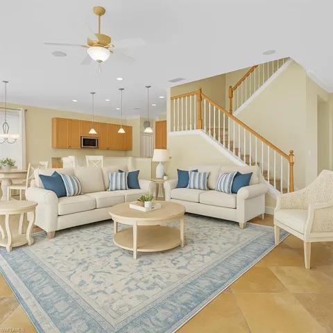 staged virtually Living area with stairs, recessed lighting, ornamental molding, light tile patterned floors, and ceiling fan