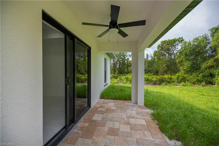 View of patio with a ceiling fan
