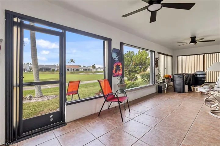 Sunroom featuring ceiling fan