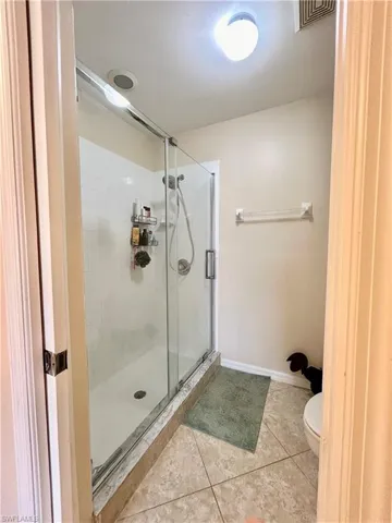 Primary shower with updated glass doors