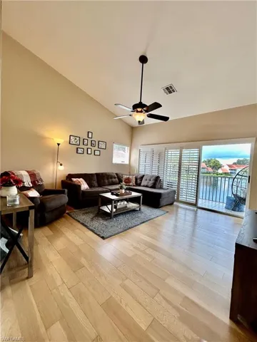 Large living room with plantation shutters on slider