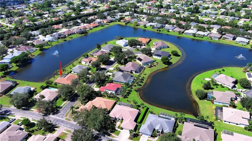 Aerial view of property's location with nearby suburban area
