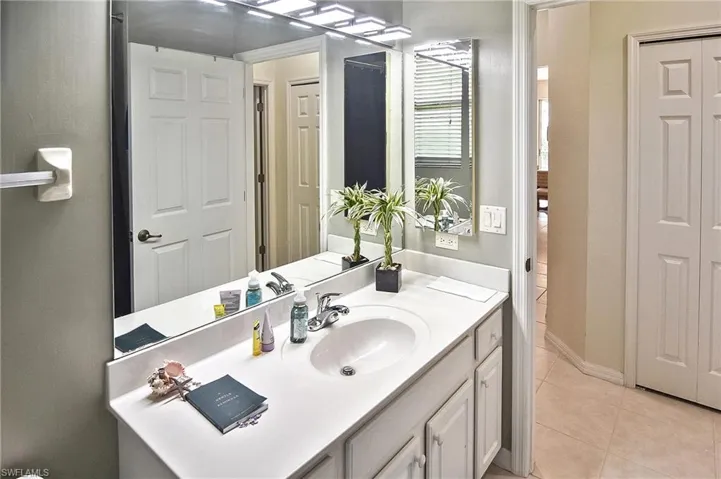 Bathroom featuring vanity and light tile patterned floors