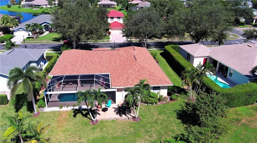 Aerial view of residential area featuring a pool