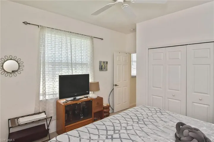 Bedroom featuring a closet and a ceiling fan