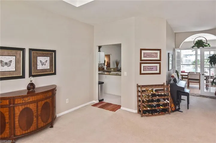 Corridor with carpet floors and baseboards