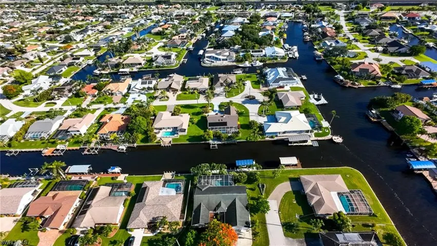 Aerial overview of property's location featuring nearby suburban area and a nearby body of water