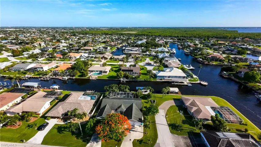 Aerial view of residential area with a nearby body of water