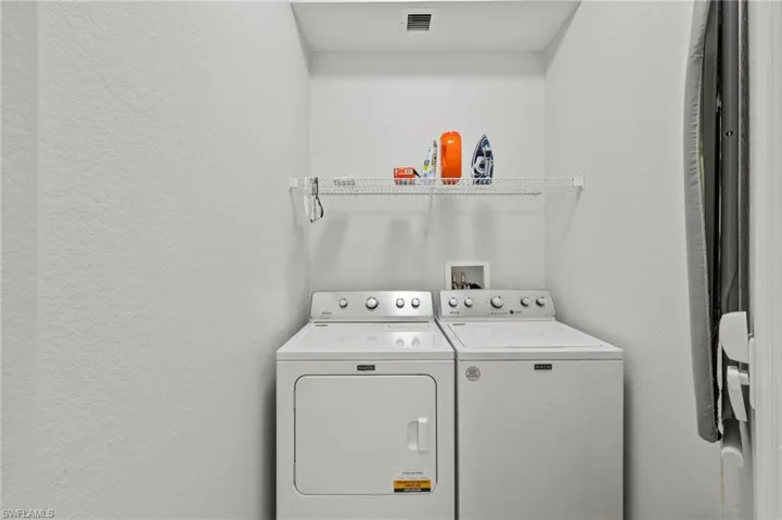 Laundry room with Brand new washer and dryer
