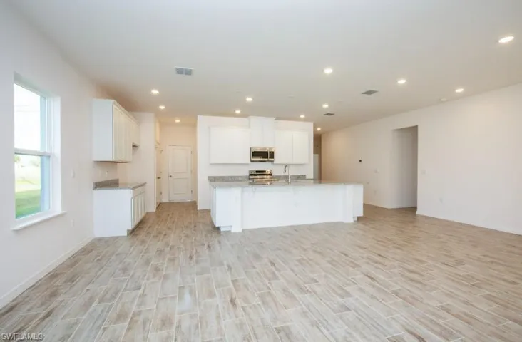 Gorgeous Kitchen -large island, granite countertops, stainless appliances, & spacious cabinets