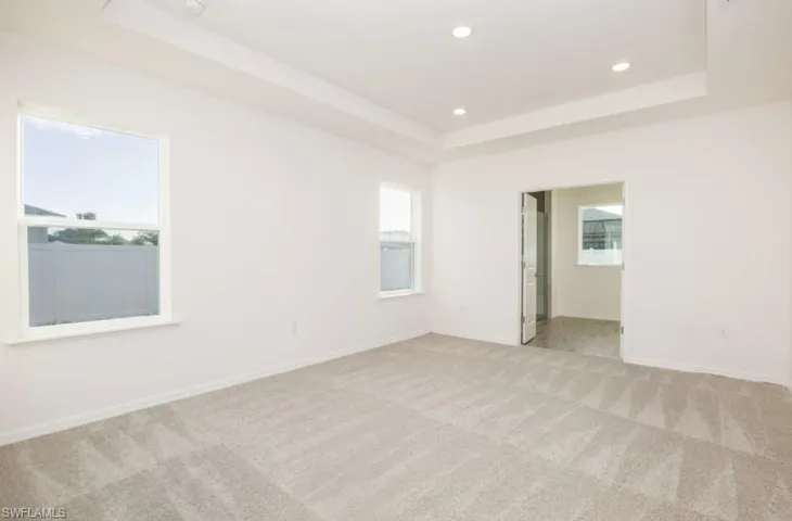 Open Great Room with plank ceramic tile flooring throughout.