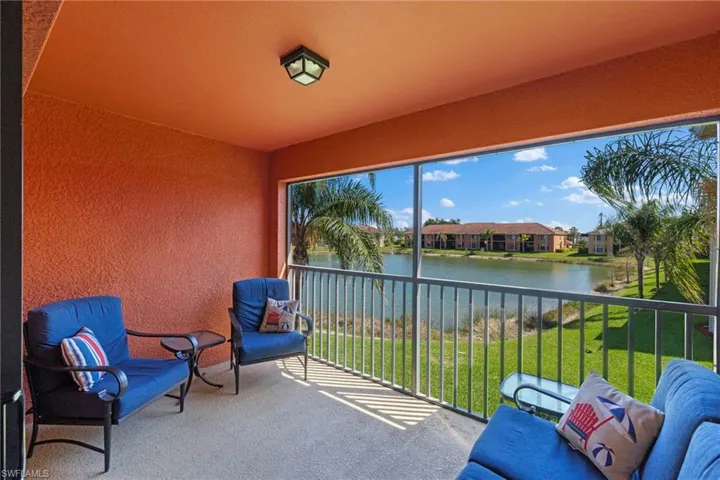 Sunroom featuring a water view