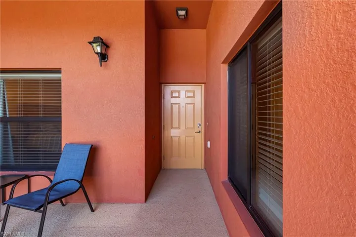 View of exterior entry with stucco siding
