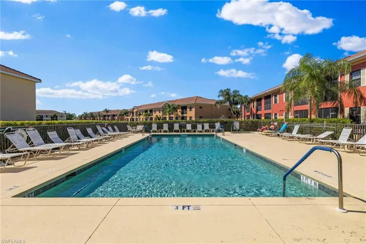 Pool featuring a patio and fence