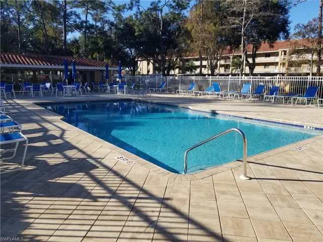 Heated pool with expanded paver brick deck with lots of room for sun bathing