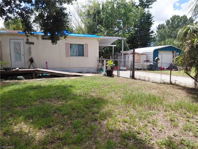 View of yard with an outdoor structure