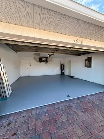Garage with electric panel and electric water heater
