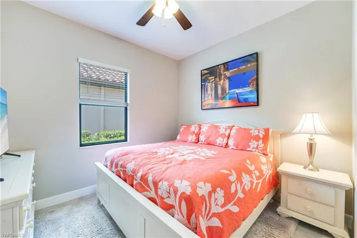 Bedroom with baseboards and a ceiling fan