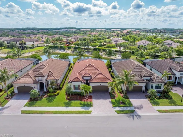 Aerial perspective of suburban area with a large body of water