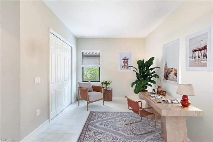 Tiled office space featuring baseboards