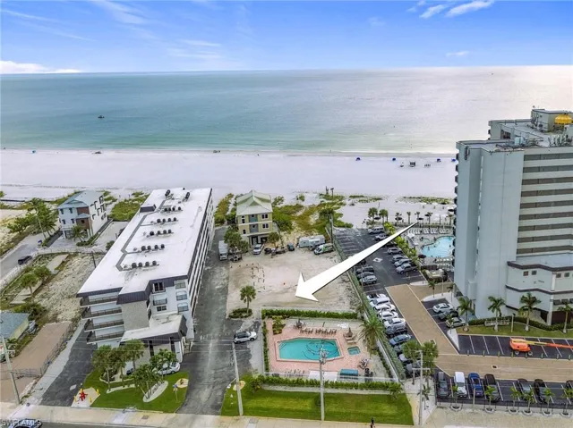 Aerial view of a pool and expansive beach