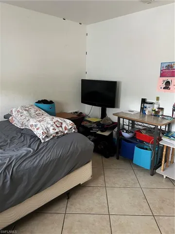 Bedroom with tile floors