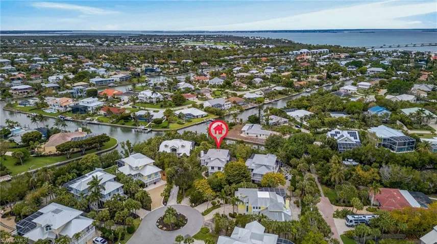 View of property location with a large body of water and nearby suburban area