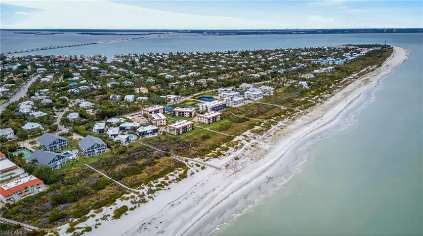 Aerial view of property's location with a nearby body of water