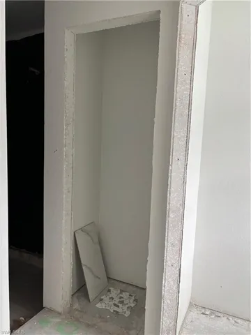Linen closet between shower area and toilet area