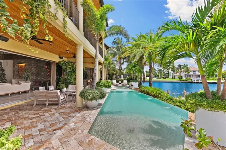 View of pool and expansive outdoor living