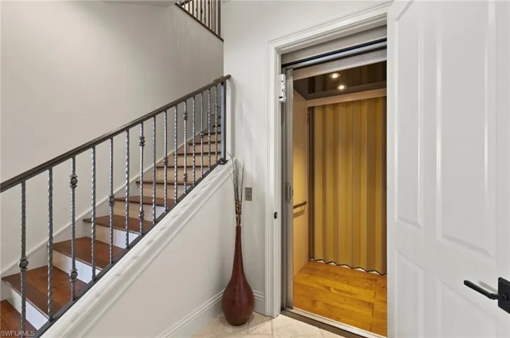 Elevator and wood staircase
