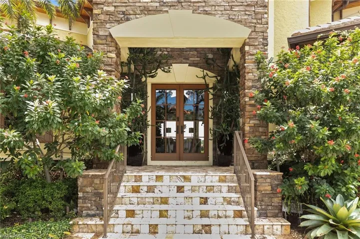 View of exterior entry featuring french doors