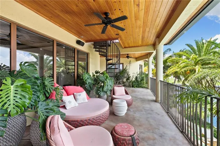 View of patio / terrace with a balcony and ceiling fan