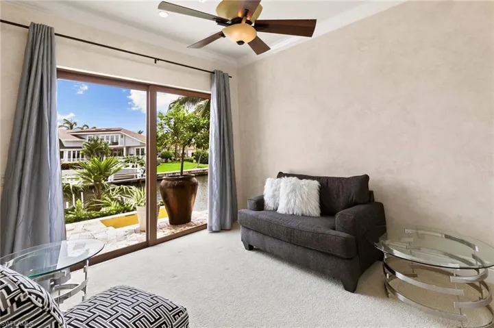 Main level guest bedroom with access to lanai.