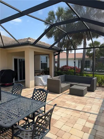 View of patio with a grill, a lanai, an outdoor living space, and outdoor dining area