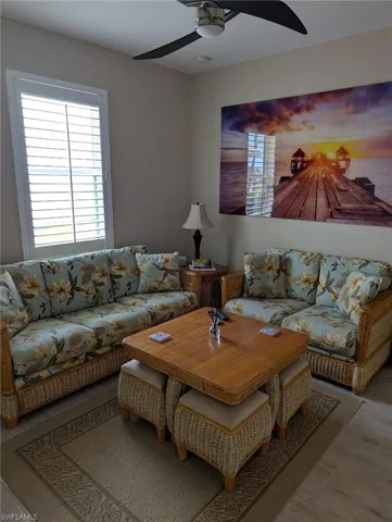 Living area featuring a ceiling fan